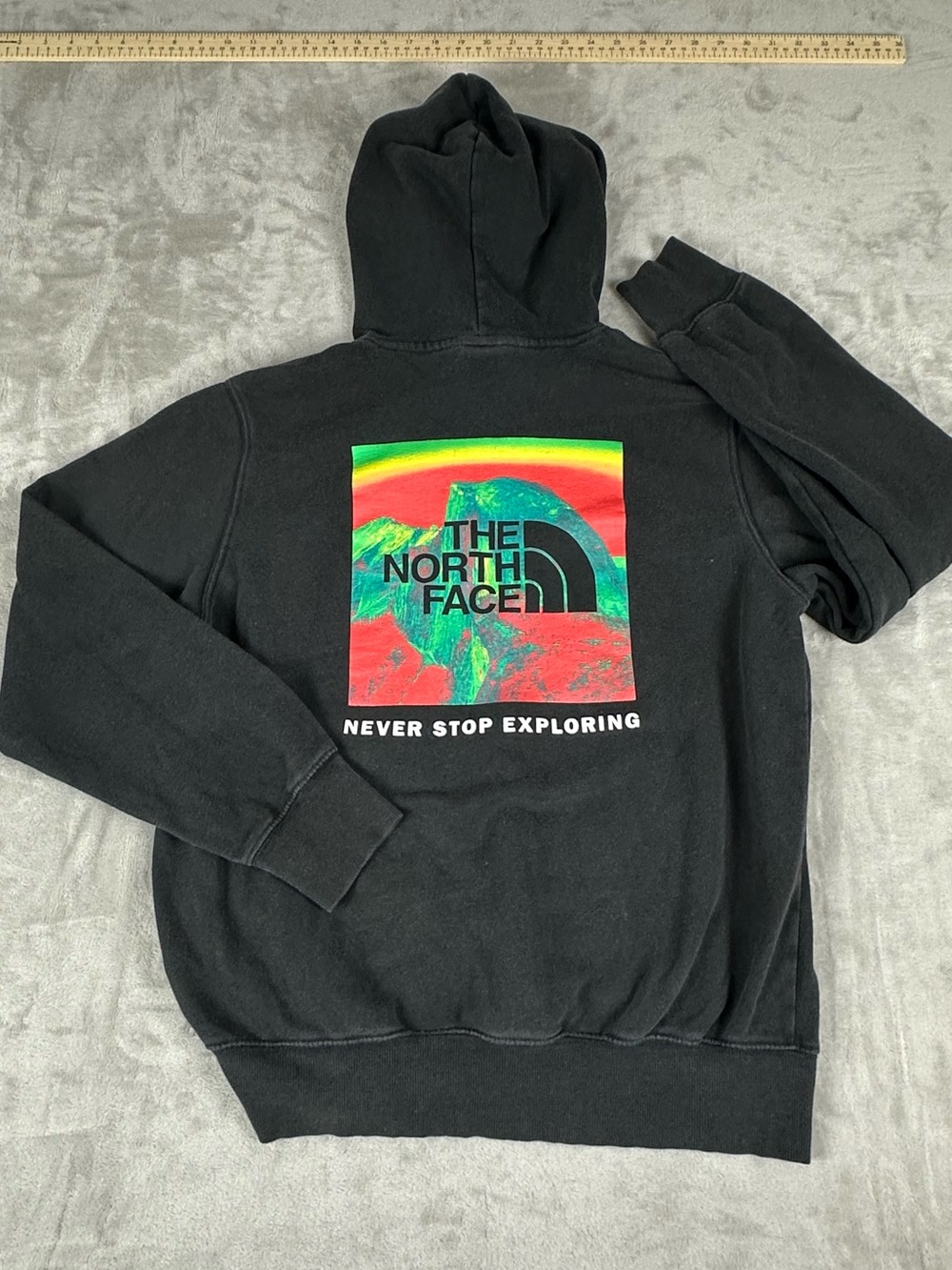 The North Face Men's Black Hoodie with Multicolor Graphic